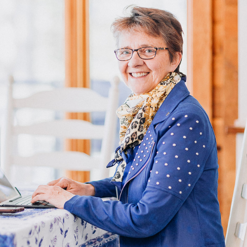 Betty-Anne Howard sitting at laptop